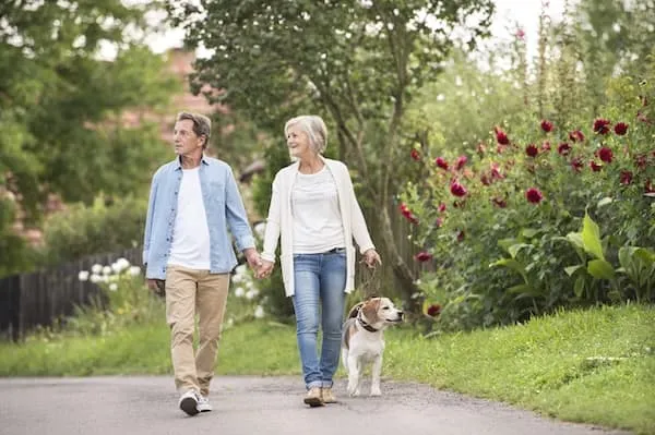 older couple walking in the park